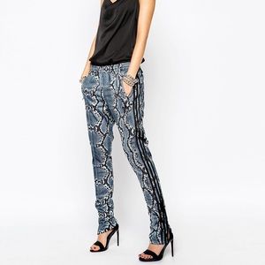 Snake print adidas pants.